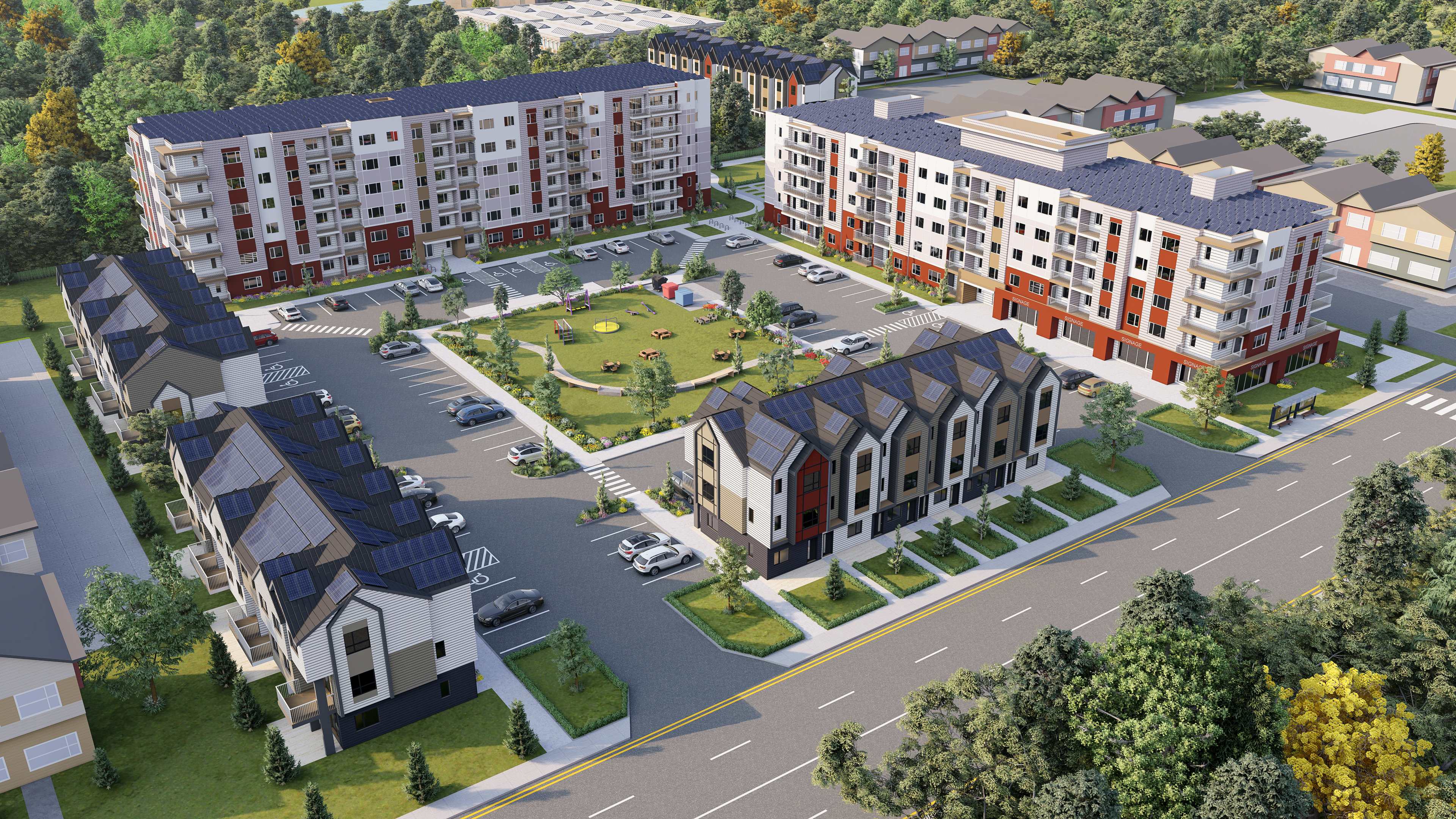 Aerial view of the complete Blue Quill development showing modern apartment buildings, townhouses, central green spaces, and community amenities
