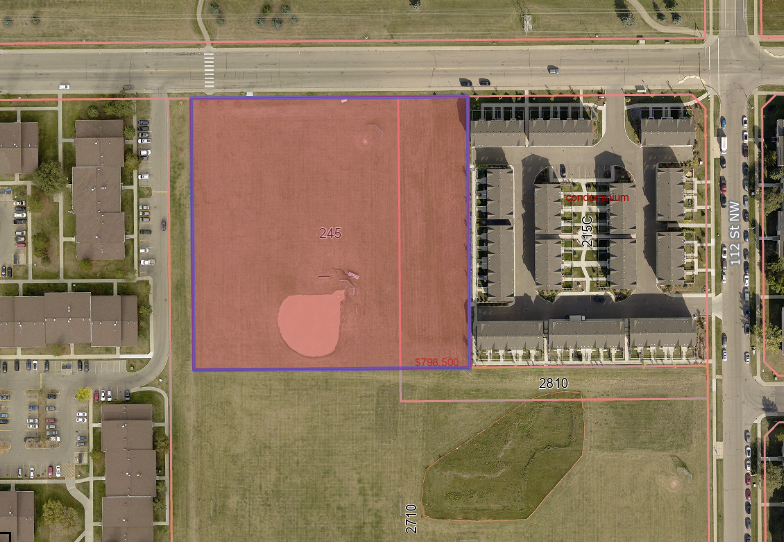 Aerial site plan showing the Blue Quill Development location at 245 Saddleback Road NW, with development boundaries outlined and surrounding residential and commercial areas visible