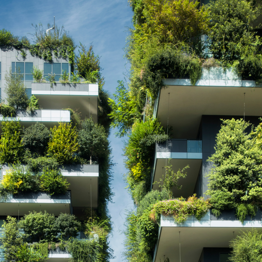Aerial view of modern sustainable buildings with green rooftops, terraces, and integrated landscaping